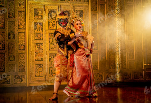 Preview: Close up beautiful Asian woman wear Thai traditional dress action of dancing together with Thai mask