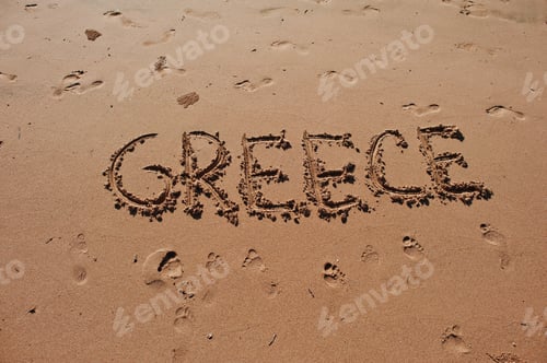 Preview: "Greece" written in the sand on the beach
