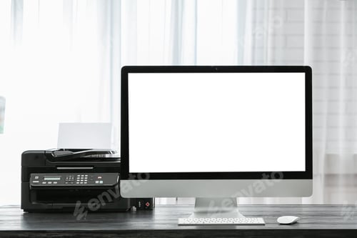 Preview: Computer on desk near window in home office. Comfortable workplace