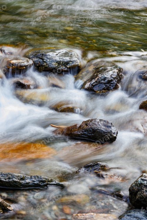 Preview: long exposure of a River stream on mountain valley.