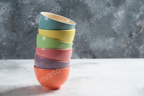 Preview: Many of colorful bowls on a gray background