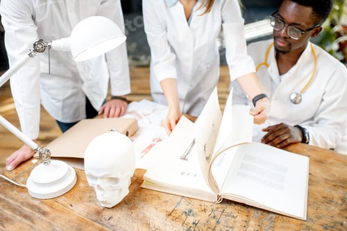 Preview: Sudying with medical book indoors