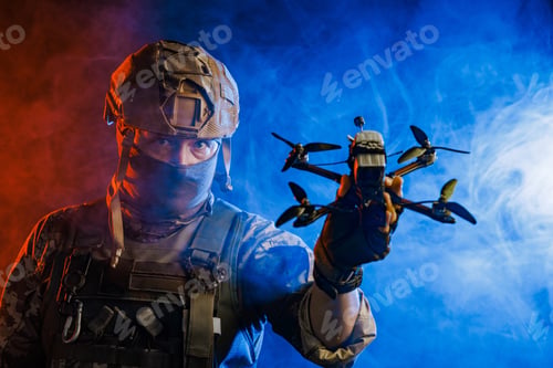 Preview: A soldier is depicted holding a drone while wearing stealth gear for military operations