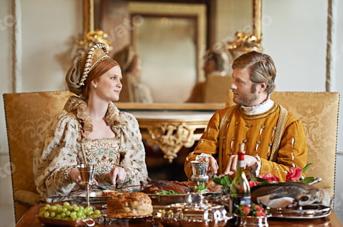 Preview: Its an ample feast. Shot of a noble couple eating together.