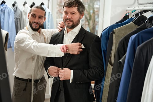 Preview: Man Getting Fitted for Suit by Tailor