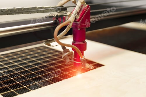 Preview: Laser plywood machine in process close up.