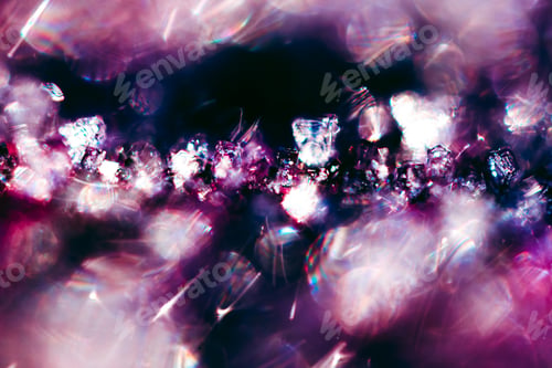 Preview: Macro shot of icy frost with pink and purple florescent lighting shining from it