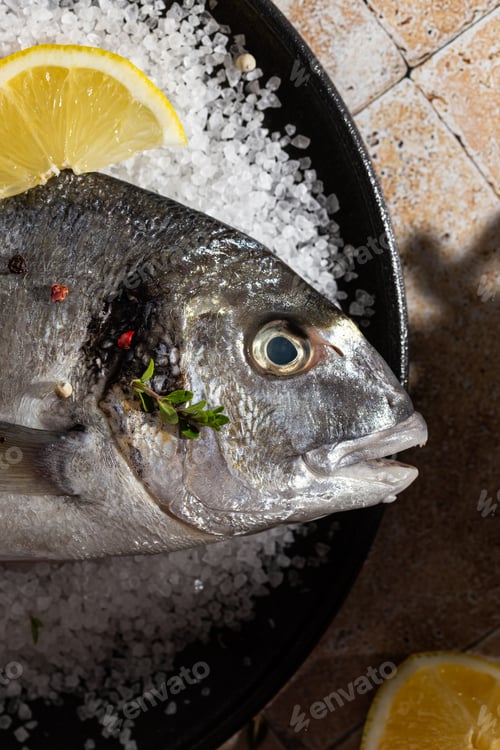 Preview: Raw fish on a sea salt before cooking