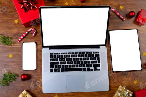 Preview: Composition of smartphone, laptop, tablet with copy space and decorations on wooden background