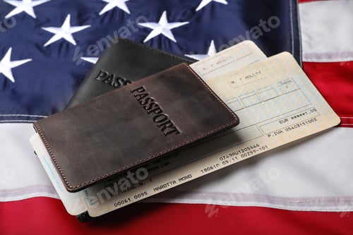 Preview: Passports and tickets on flag of USA
