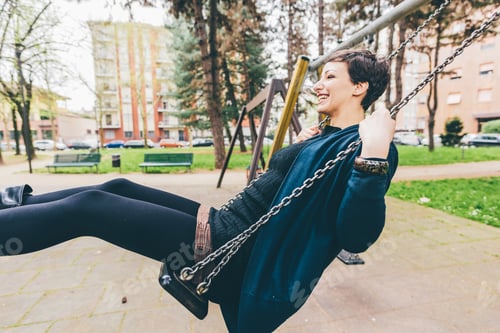 Preview: Young woman outdoor playing seesaw
