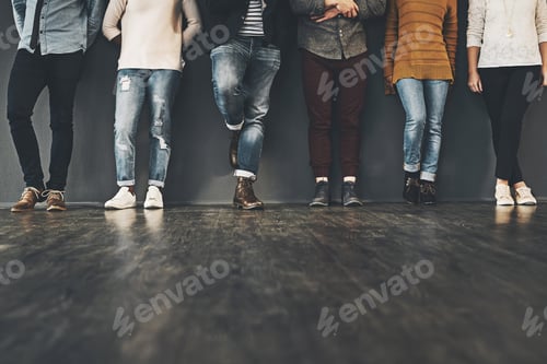 Preview: Studio shot of a group of unrecognizable people standing against a grey background