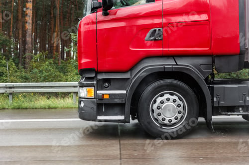 Preview: Close-up semi-trailer truck wheel driving fast Splashing Water on Highway, Risk of Aquaplaning on