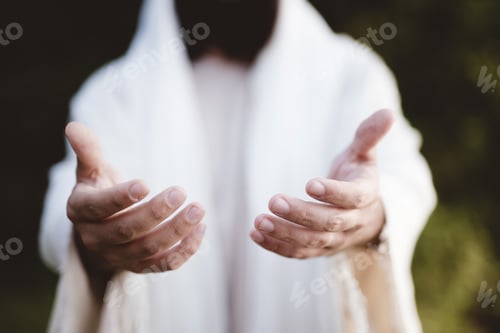 Preview: Closeup shot of Jesus Christ reaching out with a blurred background