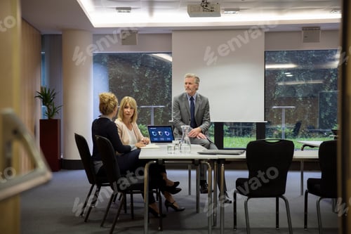 Preview: Colleagues in conference room having meeting