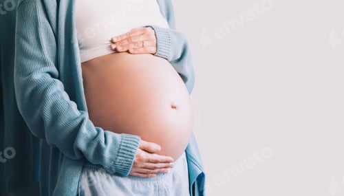 Preview: Pregnant woman holds hands on her belly. Pregnancy, maternity, preparation and expectation concept.