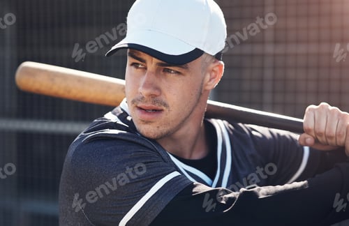 Preview: Eyes on the ball at all times. Shot of a young man swinging his bat at a baseball game.