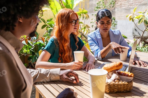 Preview: Multiethnic small group of businesspeople meeting in a coworking company office