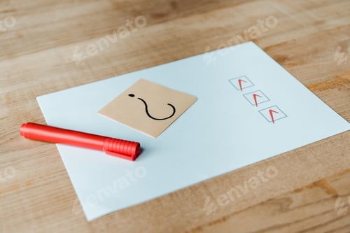 Preview: red marker pen near paper with check list and question mark on sticky note