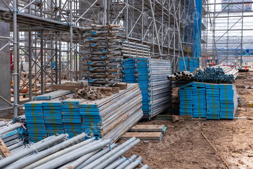 Preview: Stacked Metal Scaffolding Pipes at Construction Site