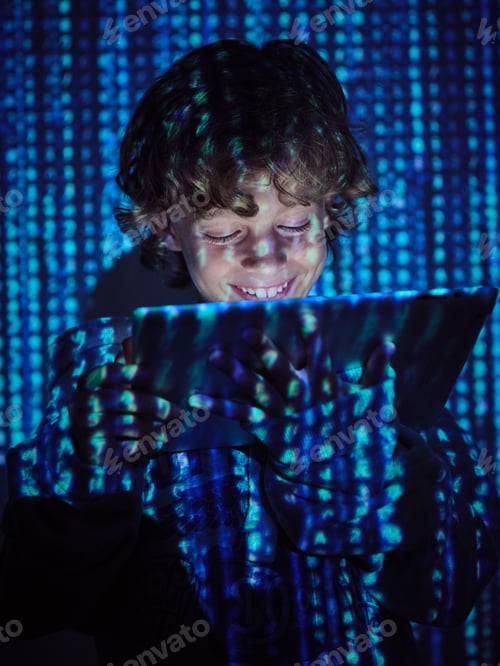 Preview: Smiling hacker with tablet on binary code background