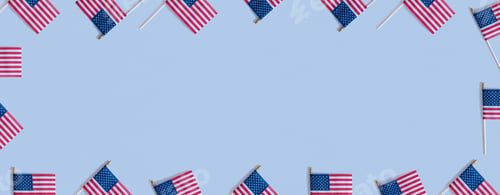 Preview: USA flags top view, flat lay on blue background with copy space. Independence day banner concept