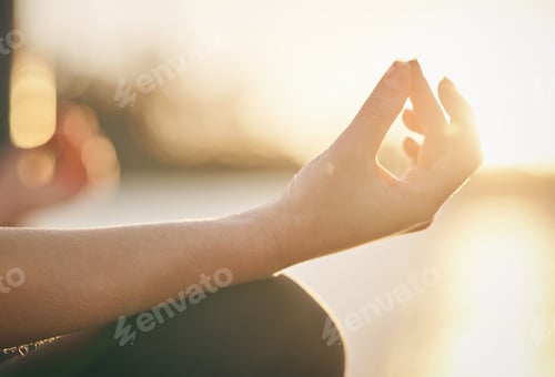 Preview: Meditation is the key to mental fitness. Close up shot of a hand in zen position outdoors.