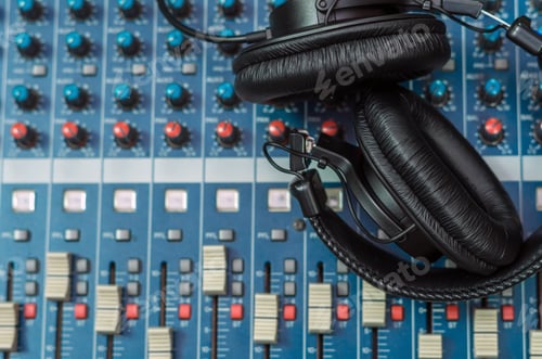 Preview: Top view of Earphone on mixer, music instrument concept