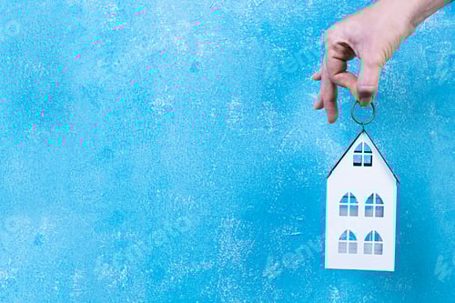 Preview: Home sweet home. Home symbol in hand on blue background.