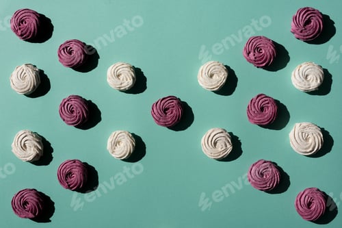 Preview: bow of berry and white marshmallows on turquoise surface