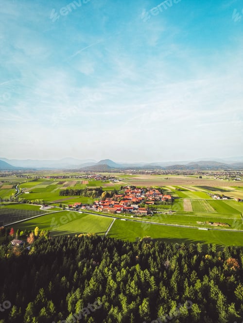 Preview: Vertical photo view of the country with some densely populated areas and a lot of green agricultural