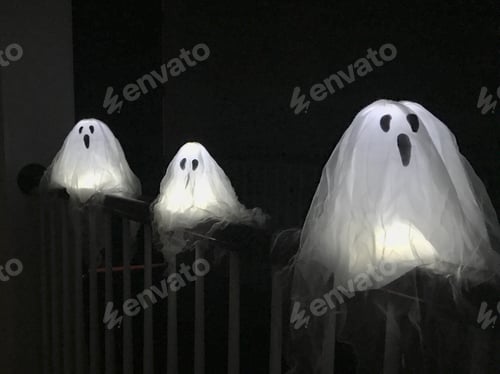 Preview: Three white ghost lights used as decorations for Halloween