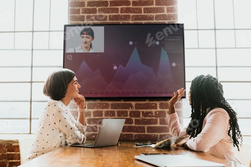 Preview: Diverse colleagues having a conference with a tv screen mockup