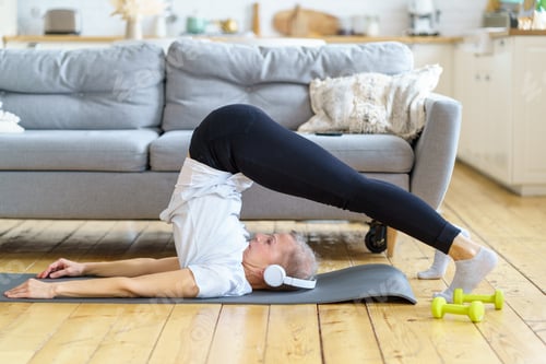 Woman Inverted Yoga Pose on Mat Indoors