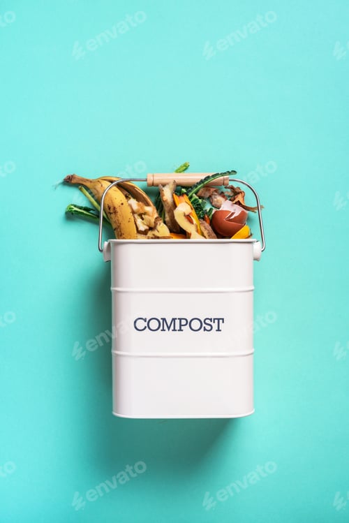 Preview: Garbage sorting. Organic food waste from vegetable ready for recycling in compost bin on blue