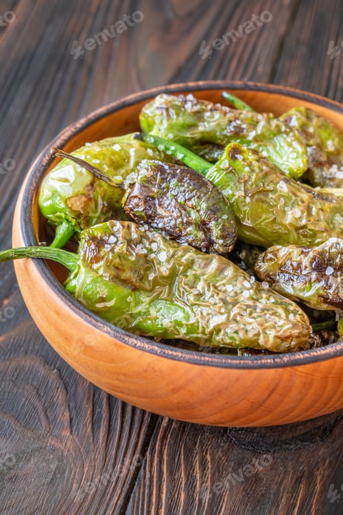 Preview: Terracotta bowl of Pimientos de Padron sprinkled with coarse sea salt