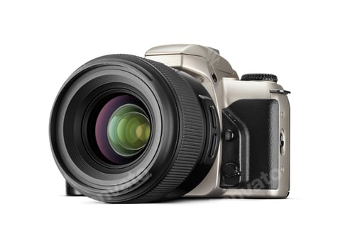 Preview: Old silver plastic SLR film photo camera with black lens isolated on white.