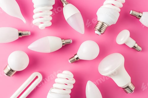 Preview: top view of various light bulbs on pink background