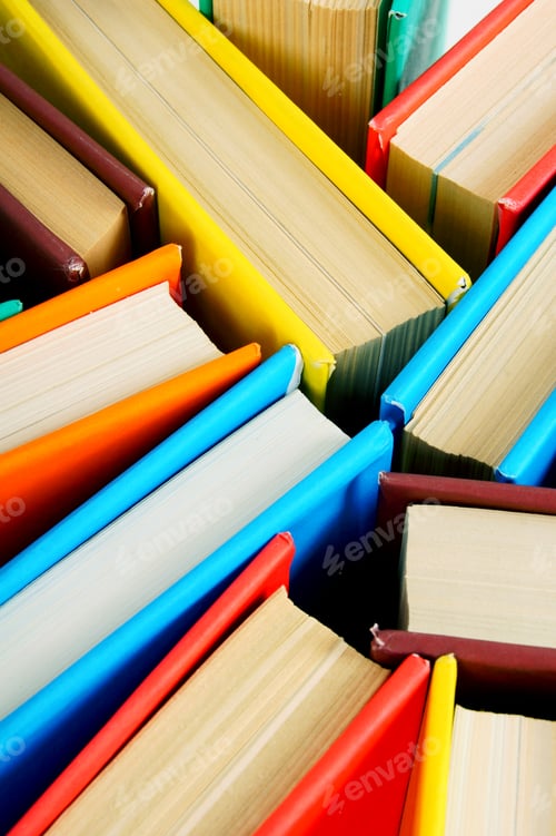 Preview: Multi-coloured books from above. Close up.