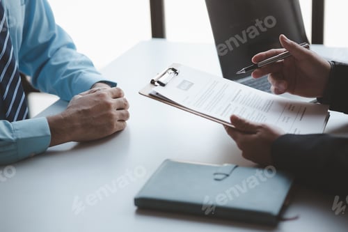 Preview: A person attends a job interview with a manager to join a company, he holds a resume and interview w