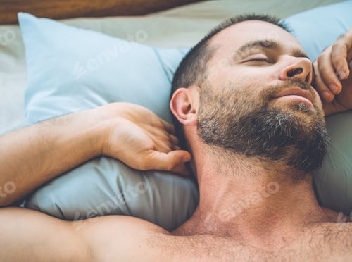 Preview: Bearded man sleeping in bed