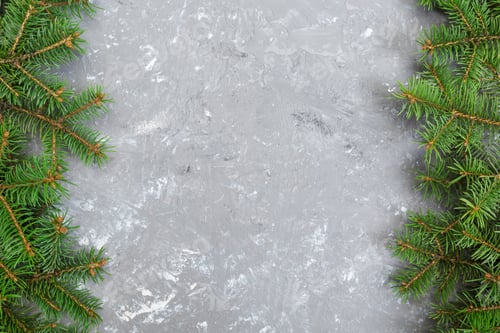Preview: Christmas gray cement background with fir tree and copy space. top view empty space for your design
