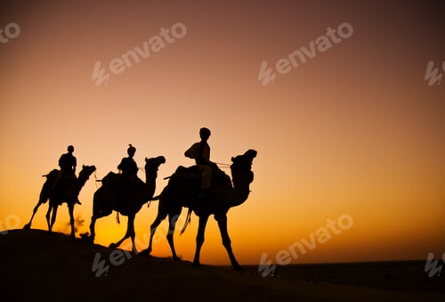 Preview: Indigenous Indian Men Riding Through The Desert With His Camel