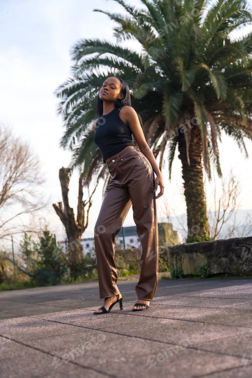 Preview: Sensual model posing with chic clothes on a park