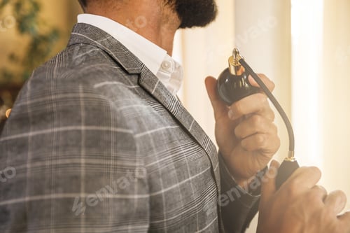 Preview: Man is using atomizer nozzle with perfume