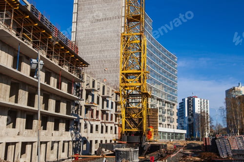 Preview: Crane and building construction site against blue sky