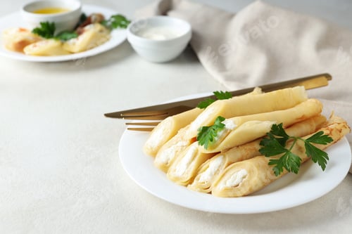 Preview: Concept of tasty food, thin pancakes with filling, space for text