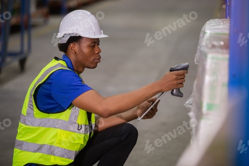 Preview: Male american african factory company employee scanning box checking number of products on goods