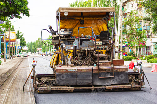 Preview: Paver on the road, road repair on the street in the city