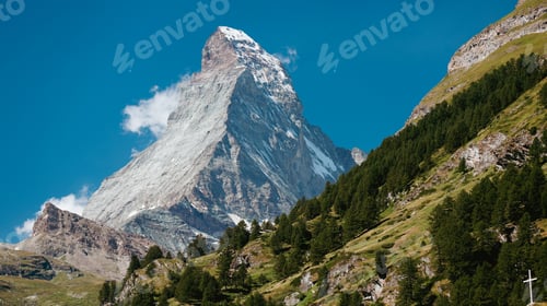 Preview: Matterhorn mountain rising majestically above the lush green slopes in Zermatt, Switzerland,
